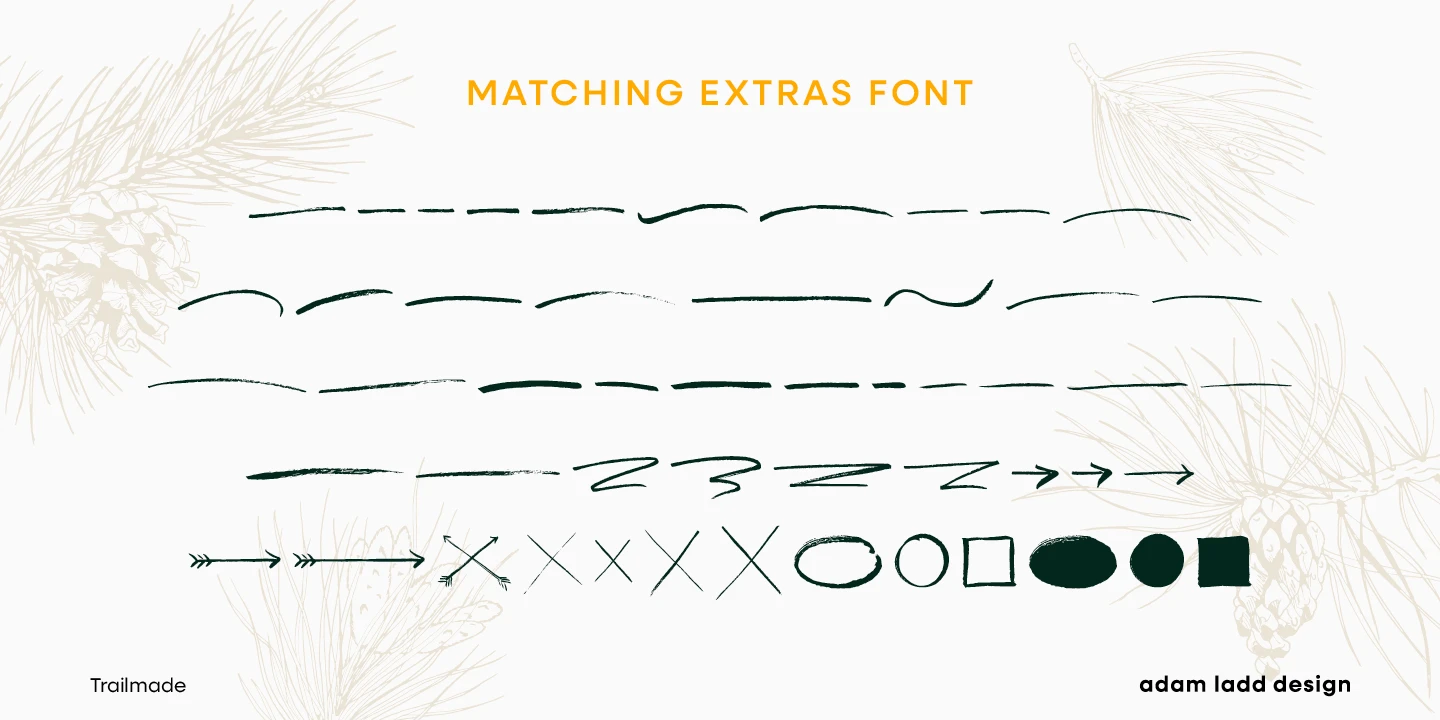 Trailmade font by Adam Ladd Design — the words “MATCHING EXTRAS FONT” above rows of brush-stroke lines, arrows, X’s, circles, and squares, with pine needles and cones in the background