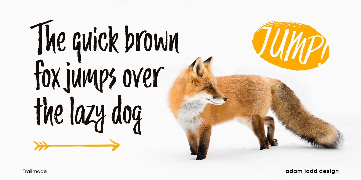 Trailmade font by Adam Ladd Design — a red fox standing in snow next to the upright brush script words “The quick brown fox jumps over the lazy dog” and a yellow arrow, with the word “JUMP!” in a yellow oval above the fox