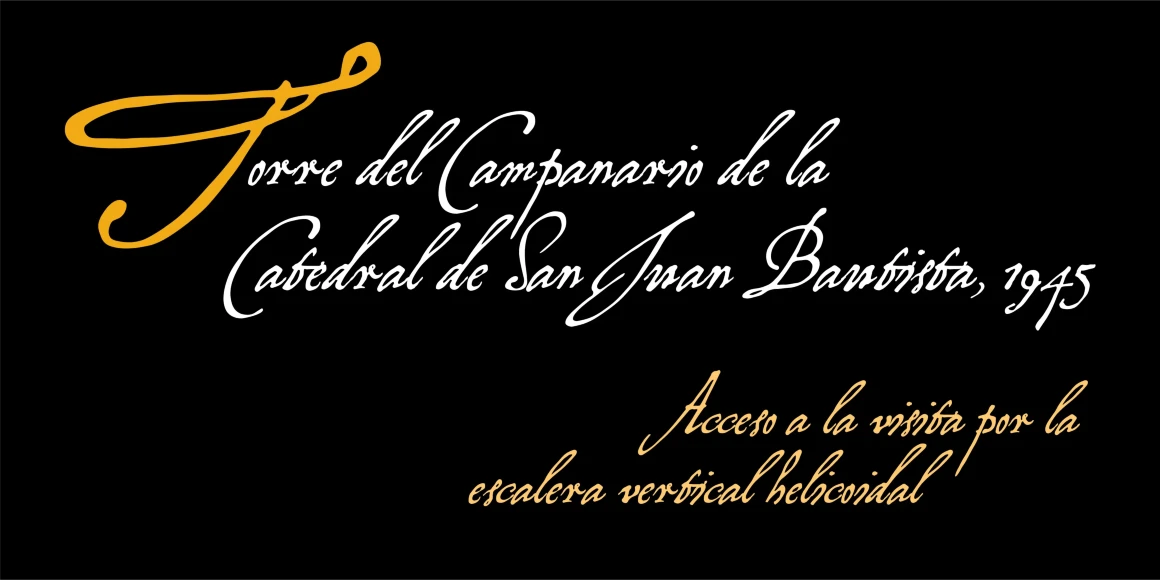 Virginian font by P22 Type Foundry — Spanish text in a cursive handwriting script on a black background, featuring a large yellow initial T in the phrase Torre del Campanario de la Catedral de San Juan Bautista, 1945, with additional yellow text below reading Acceso a la visita por la escalera vertical helicoidal